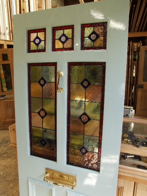 3 over 2 panel front door painted and incorporating stained glass panels with brilliant cut inserts